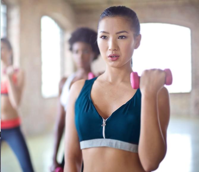 female  health coach of Smart Start Session in her fitness class